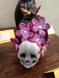 A butterfly over flowers that are over...a skull..... I'm beginning to notice a trend.